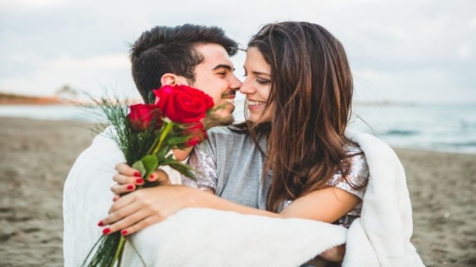 loving-couple-sitting-beach-with-bouquet-roses_23-2147595917_680x380